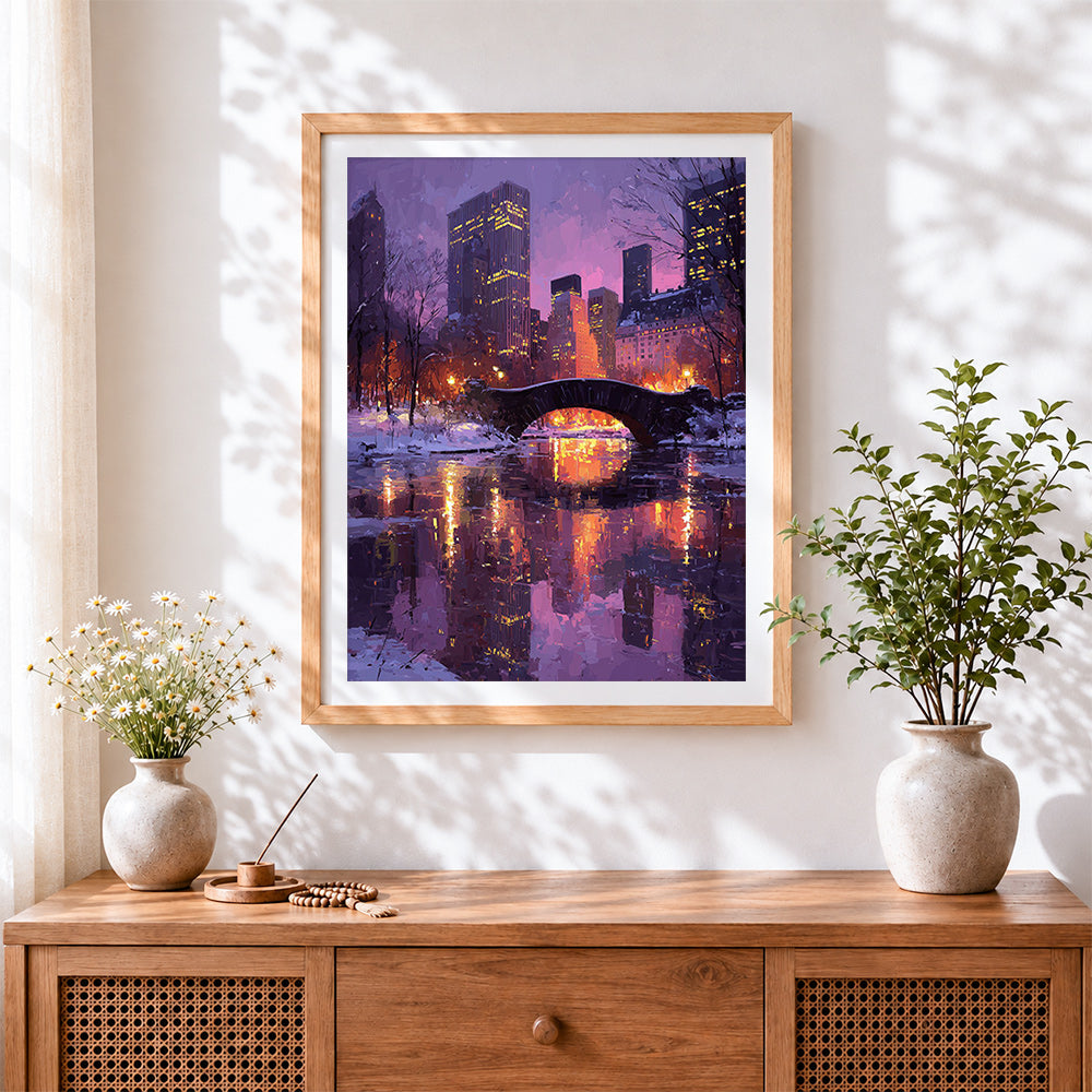 Finished snowy central park bridge cross stitch artwork displayed