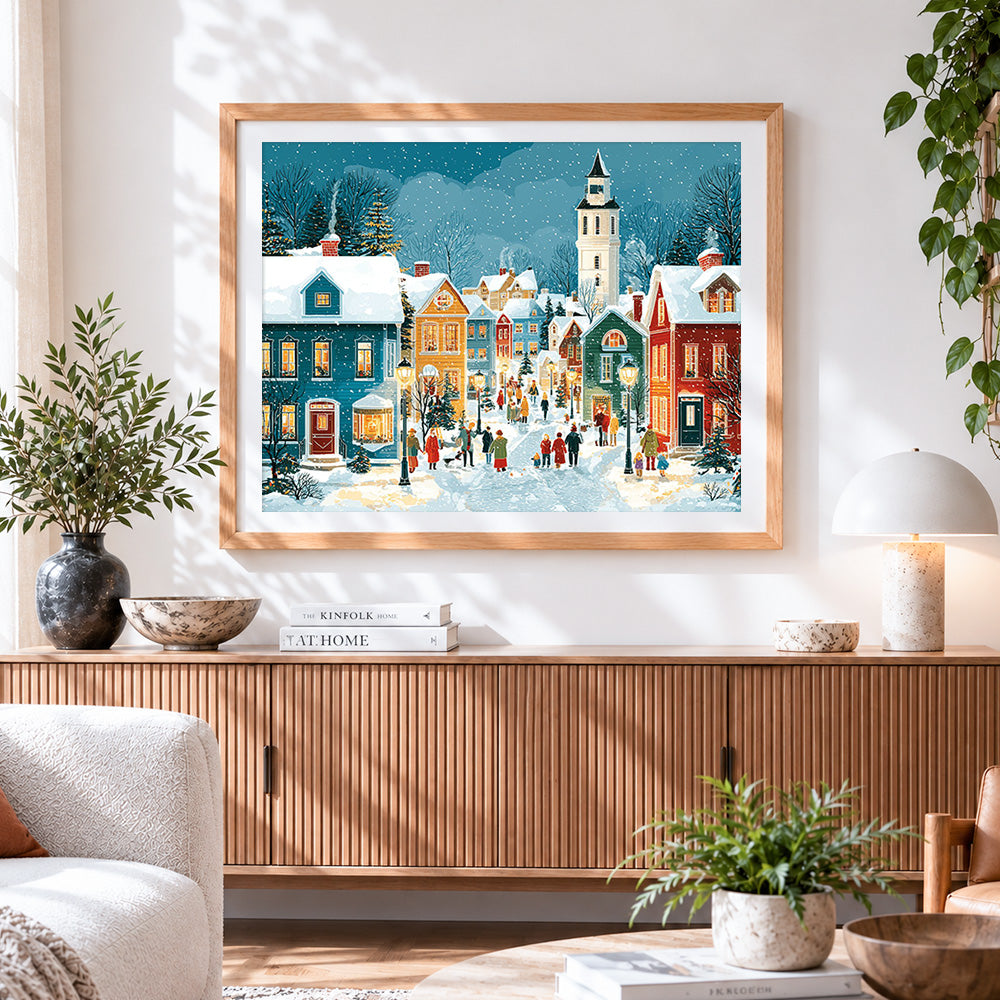 Finished snowy christmas village cross stitch artwork displayed
