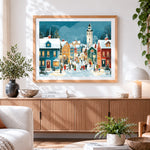Finished snowy christmas village cross stitch artwork displayed