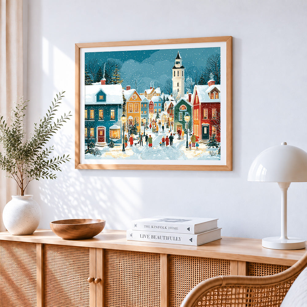 Snowy christmas village cross stitch artwork displayed on wall as home decor