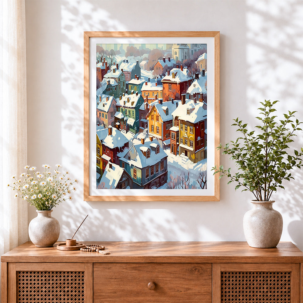 Finished snowy colourful village rooftops cross stitch artwork displayed