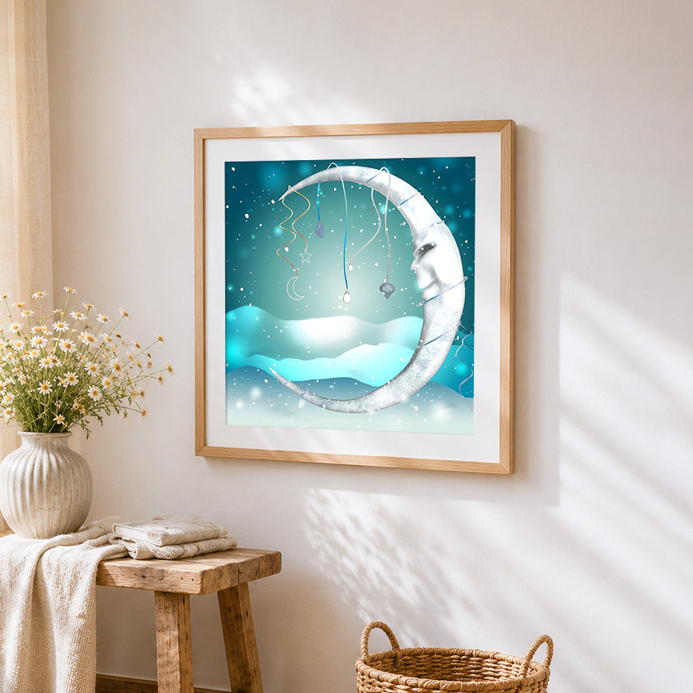 Snowy crescent moon cross stitch artwork displayed on wall as home decor