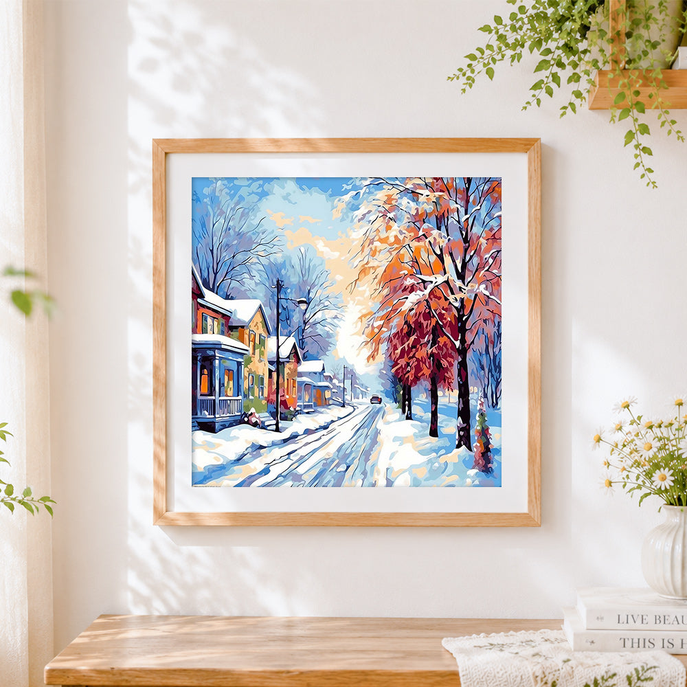 Finished snowy european street with trees cross stitch artwork displayed