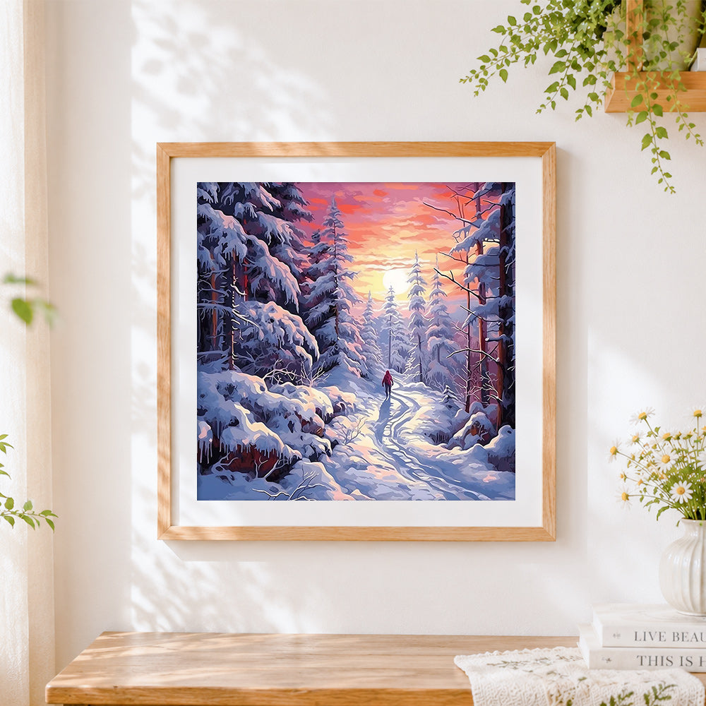 Finished snowy forest path at sunset cross stitch artwork displayed
