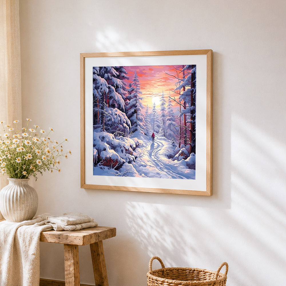 Snowy forest path at sunset cross stitch artwork displayed on wall as home decor