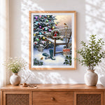 Finished snowy garden bench and robin cross stitch artwork displayed