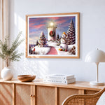 Snowy lighthouse and snowman coastal scene cross stitch artwork displayed on wall as home decor