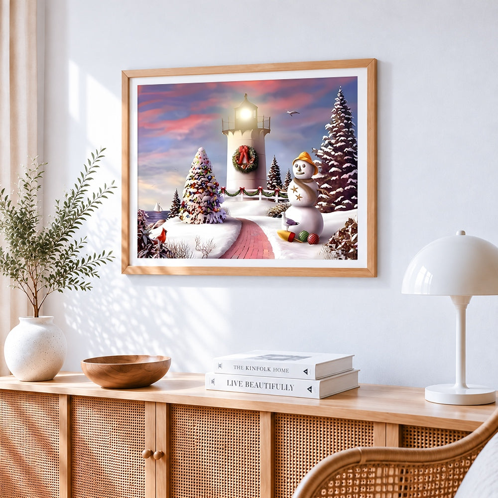 Snowy lighthouse and snowman coastal scene cross stitch artwork displayed on wall as home decor