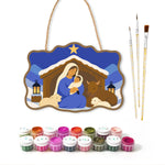 Snowy manger scene paint by numbers door hanger with paints and brushes