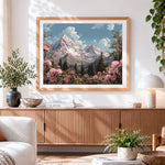 Finished snowy mountain and pink rhododendrons cross stitch artwork displayed