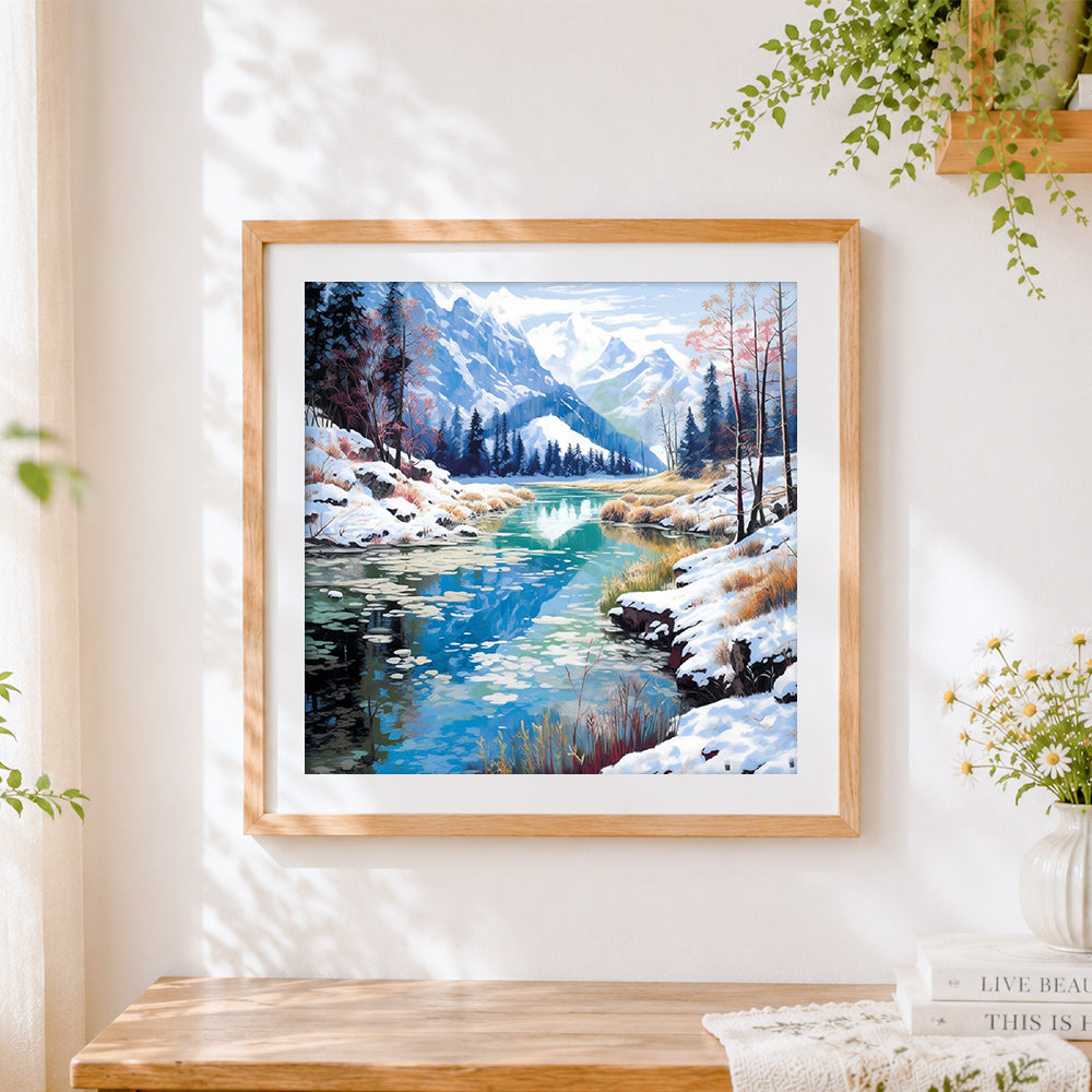 Finished snowy mountain reflection in a turquoise lake cross stitch artwork displayed