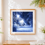 Finished snowy night forest with street lamp cross stitch artwork displayed