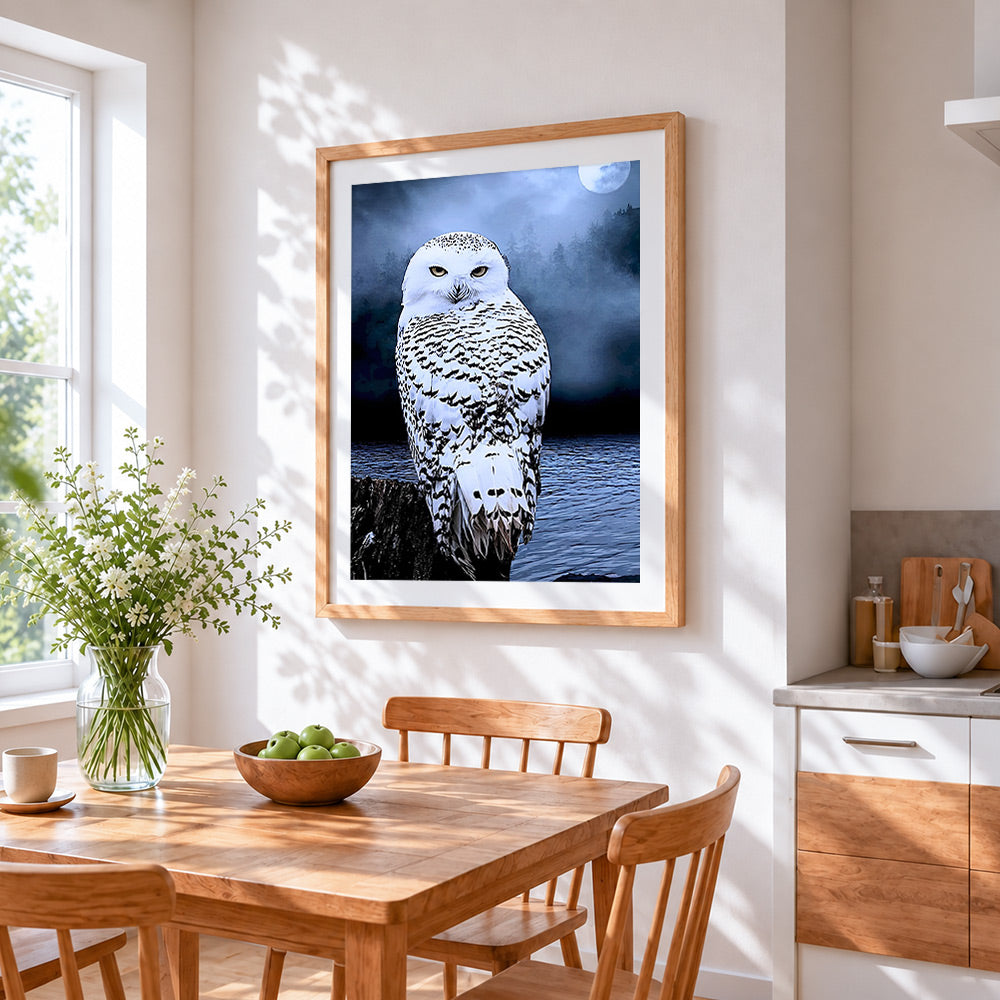 Snowy owl and full moon cross stitch artwork displayed on wall as home decor