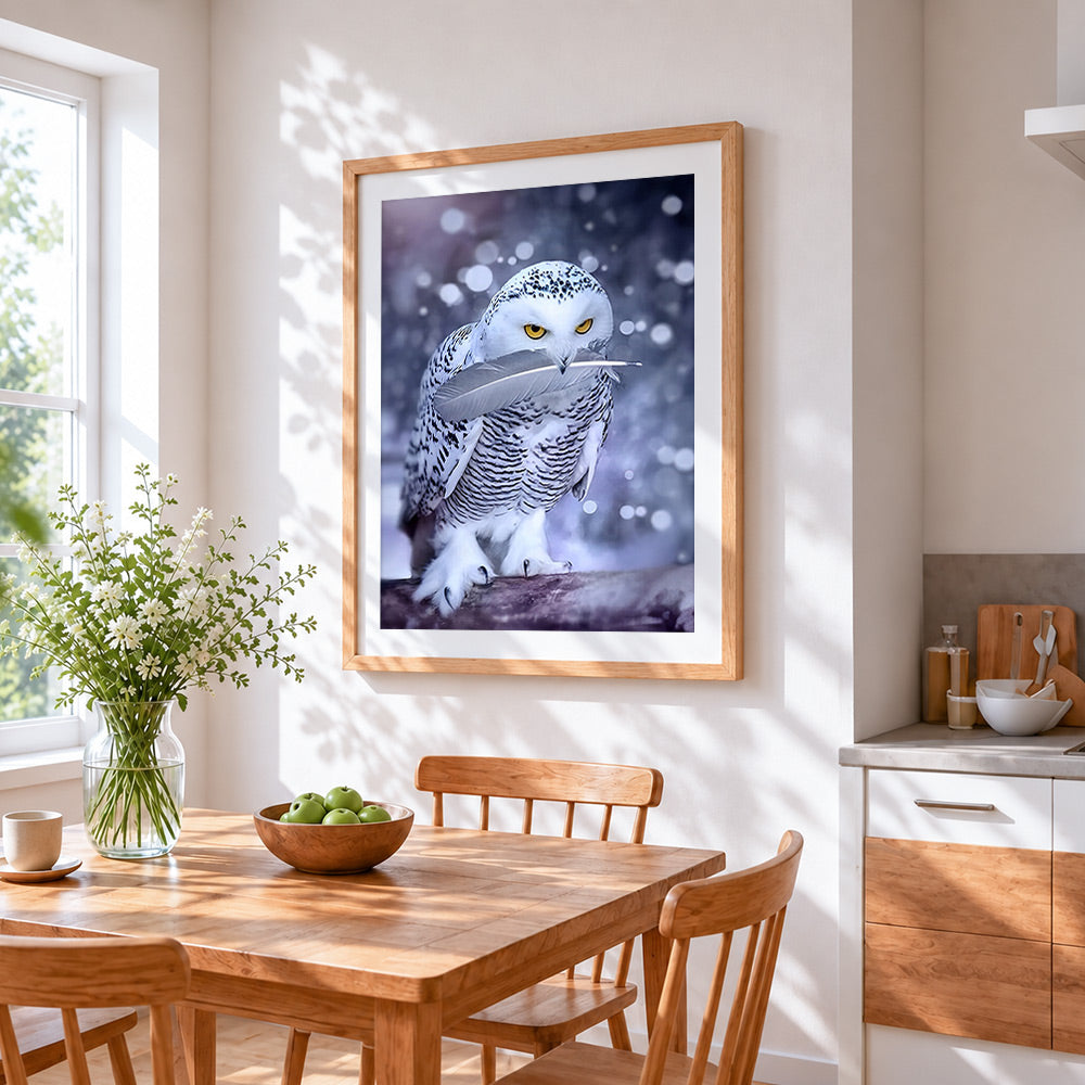 Snowy owl with feather cross stitch artwork displayed on wall as home decor
