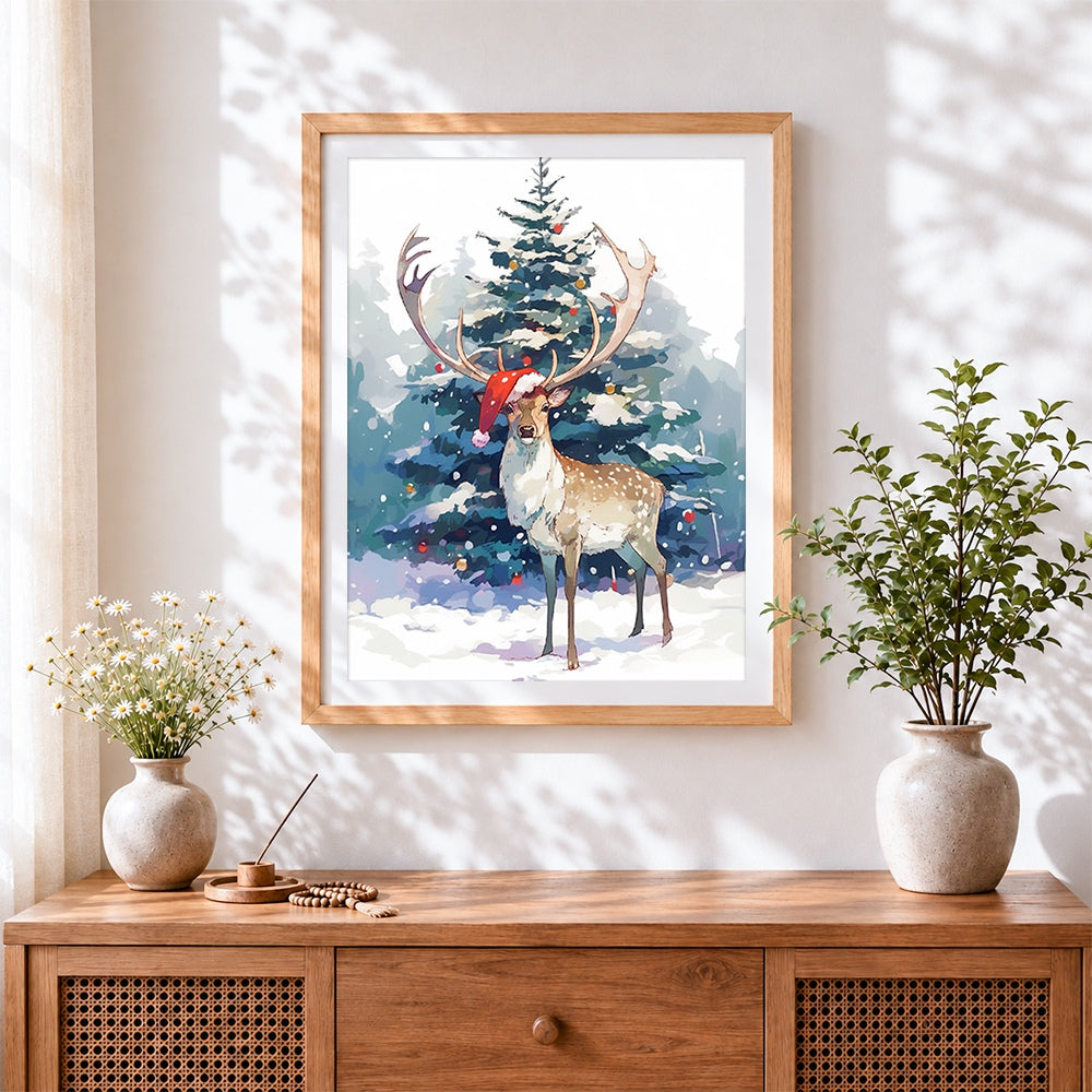 Finished snowy reindeer and christmas tree cross stitch artwork displayed
