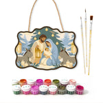 Snowy sacred scene paint by numbers door hanger with paints and brushes