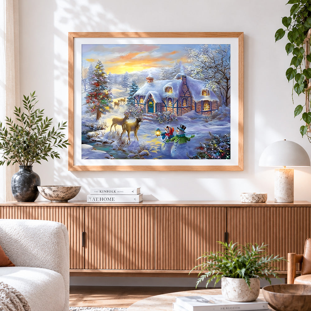 Finished snowy thatched cottage and deer at sunset paint by numbers artwork displayed as home decor