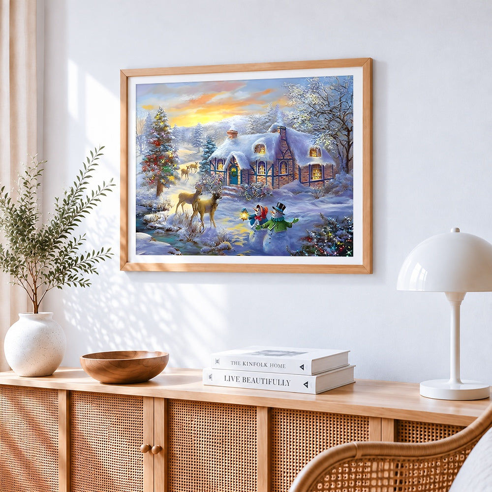 Snowy thatched cottage and deer at sunset paint by numbers artwork displayed on wall as home decor