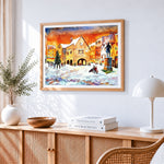Snowy town square watercolour cross stitch artwork displayed on wall as home decor