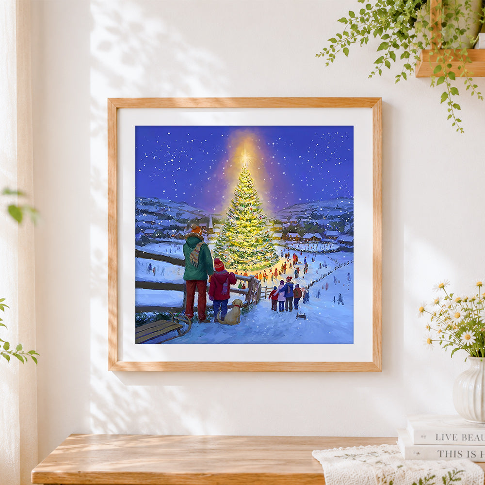 Finished snowy village with glowing christmas tree cross stitch artwork displayed