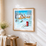 Snowy village with red post box cross stitch artwork displayed on wall as home decor