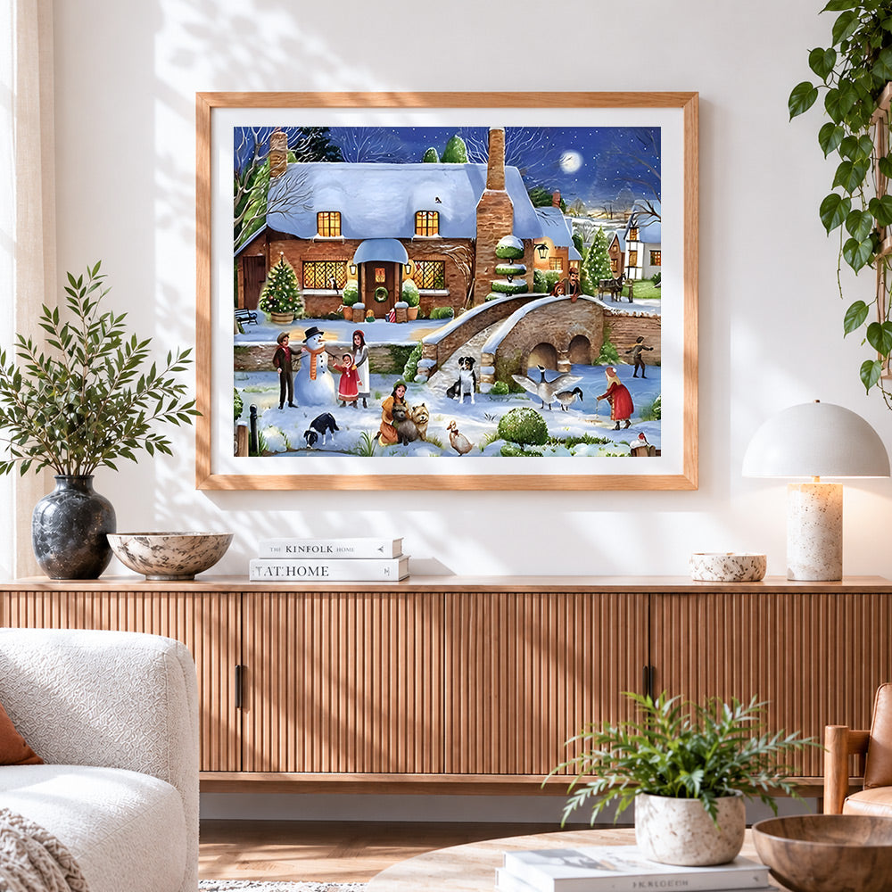 Finished snowy village with snowman and children paint by numbers artwork displayed as home decor