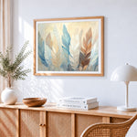 Soft pastel feathers cross stitch artwork displayed on wall as home decor