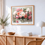 Soft pastel roses in a glass vase cross stitch artwork displayed on wall as home decor