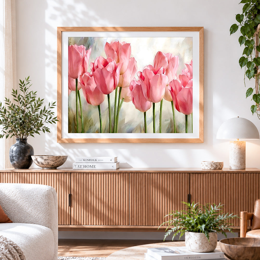 Finished soft pink tulips cross stitch artwork displayed