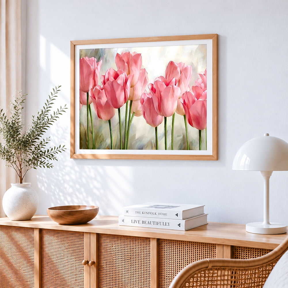 Soft pink tulips cross stitch artwork displayed on wall as home decor
