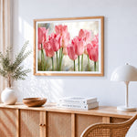 Soft pink tulips cross stitch artwork displayed on wall as home decor