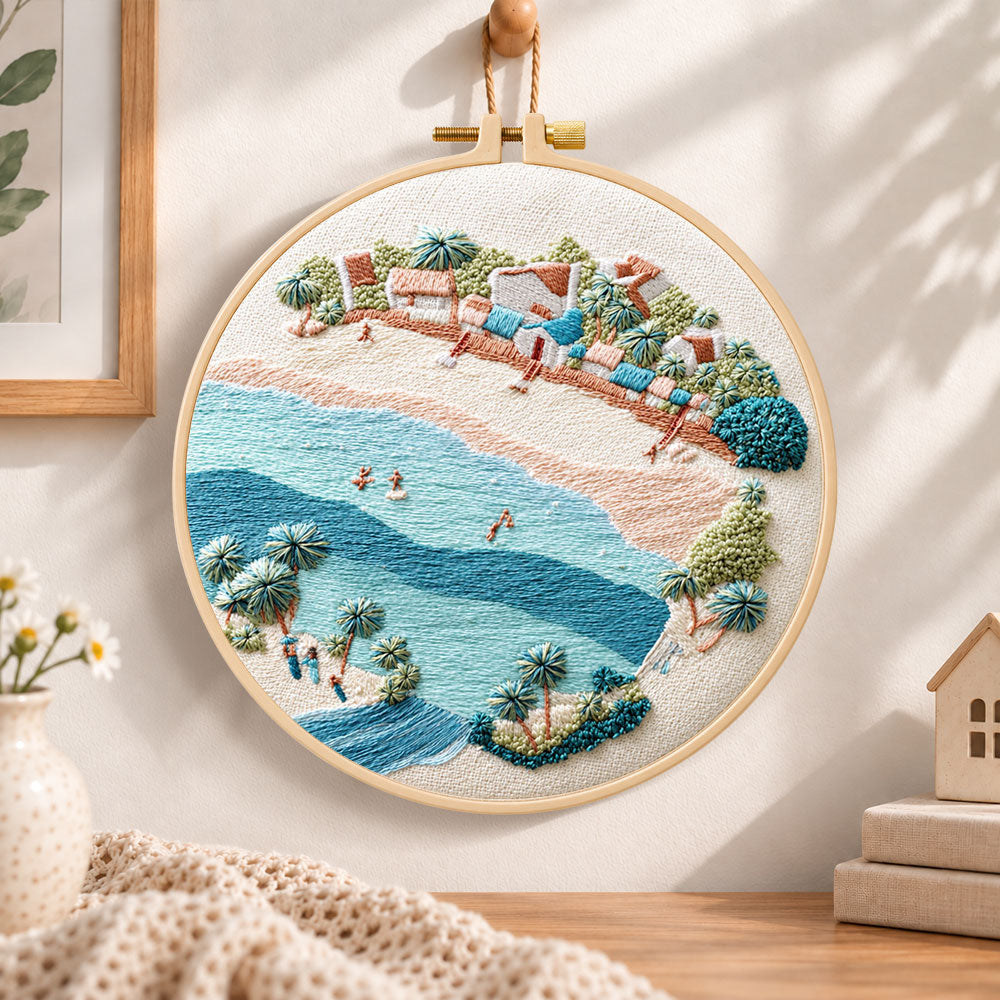 Soft seaside town embroidery hoop wall art displayed as warm and cosy handmade home decor
