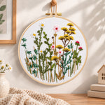Soft wild daisy mix embroidery hoop wall art displayed as warm and cosy handmade home decor