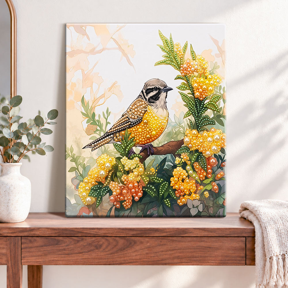 Finished songbird on blossom branch pearl diamond painting artwork displayed as home decor