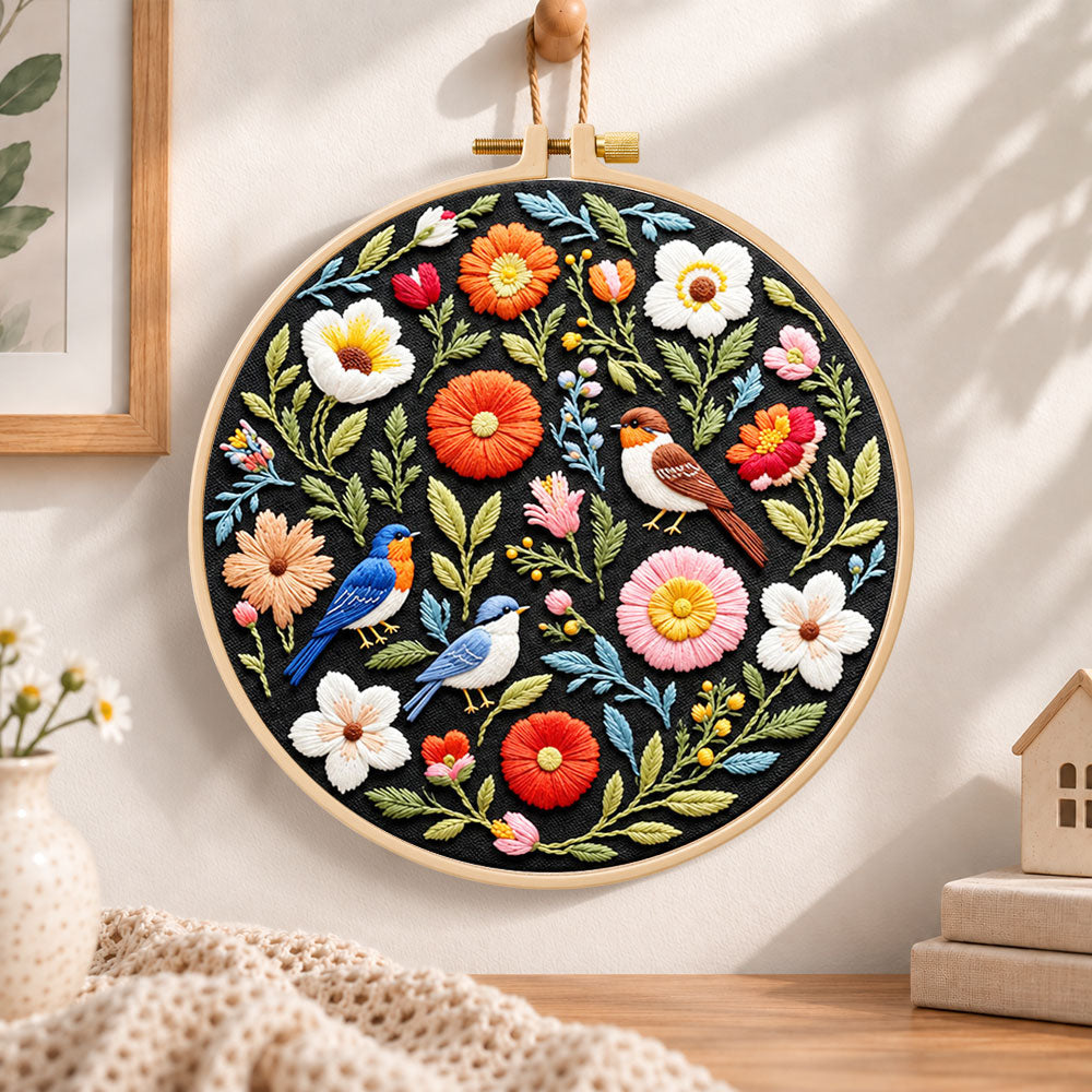 Songbirds and vibrant blooms embroidery hoop wall art displayed as warm and cosy handmade home decor