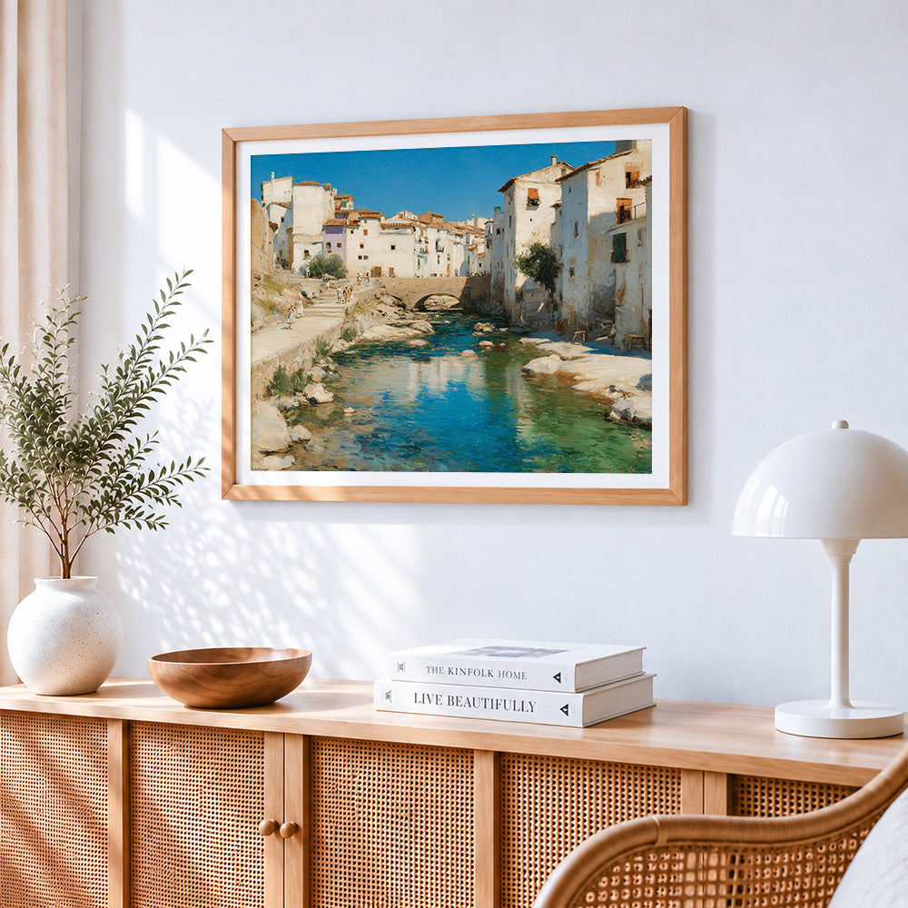 Spanish white town and river cross stitch artwork displayed on wall as home decor