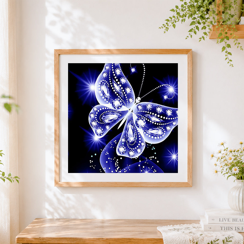 Finished sparkling blue crystal butterfly cross stitch artwork displayed