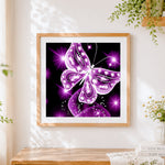 Finished sparkling purple crystal butterfly cross stitch artwork displayed