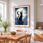 Spooky black cat on chimney under full moon cross stitch artwork displayed on wall as home decor
