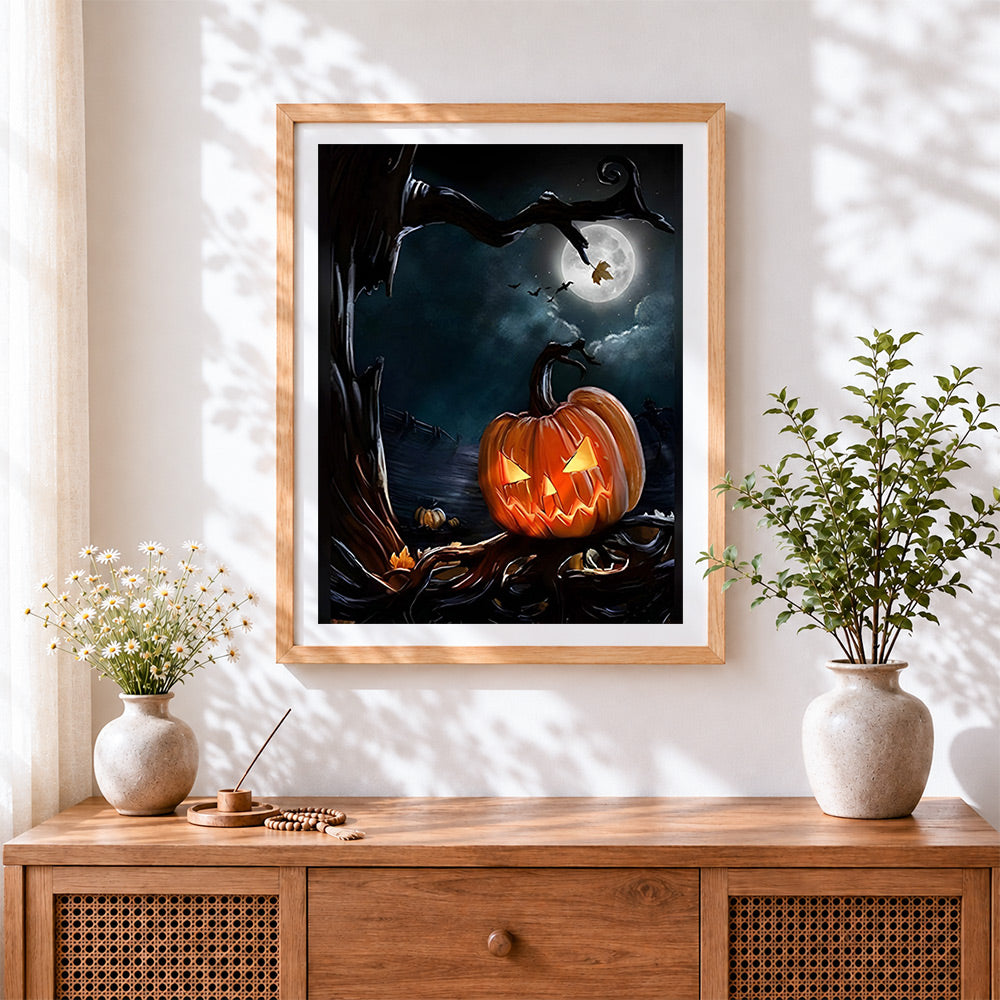 Finished spooky full moon and jack-o'-lantern cross stitch artwork displayed