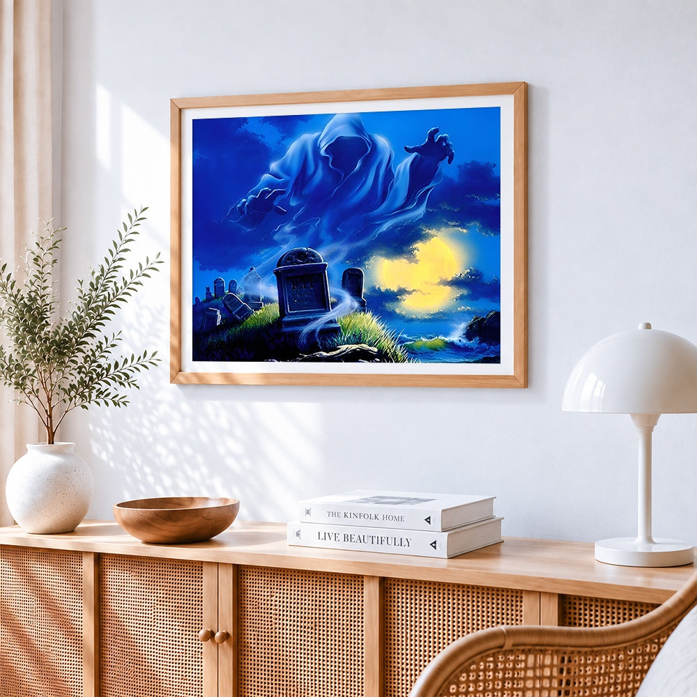 Spooky ghost in a graveyard by the sea cross stitch artwork displayed on wall as home decor