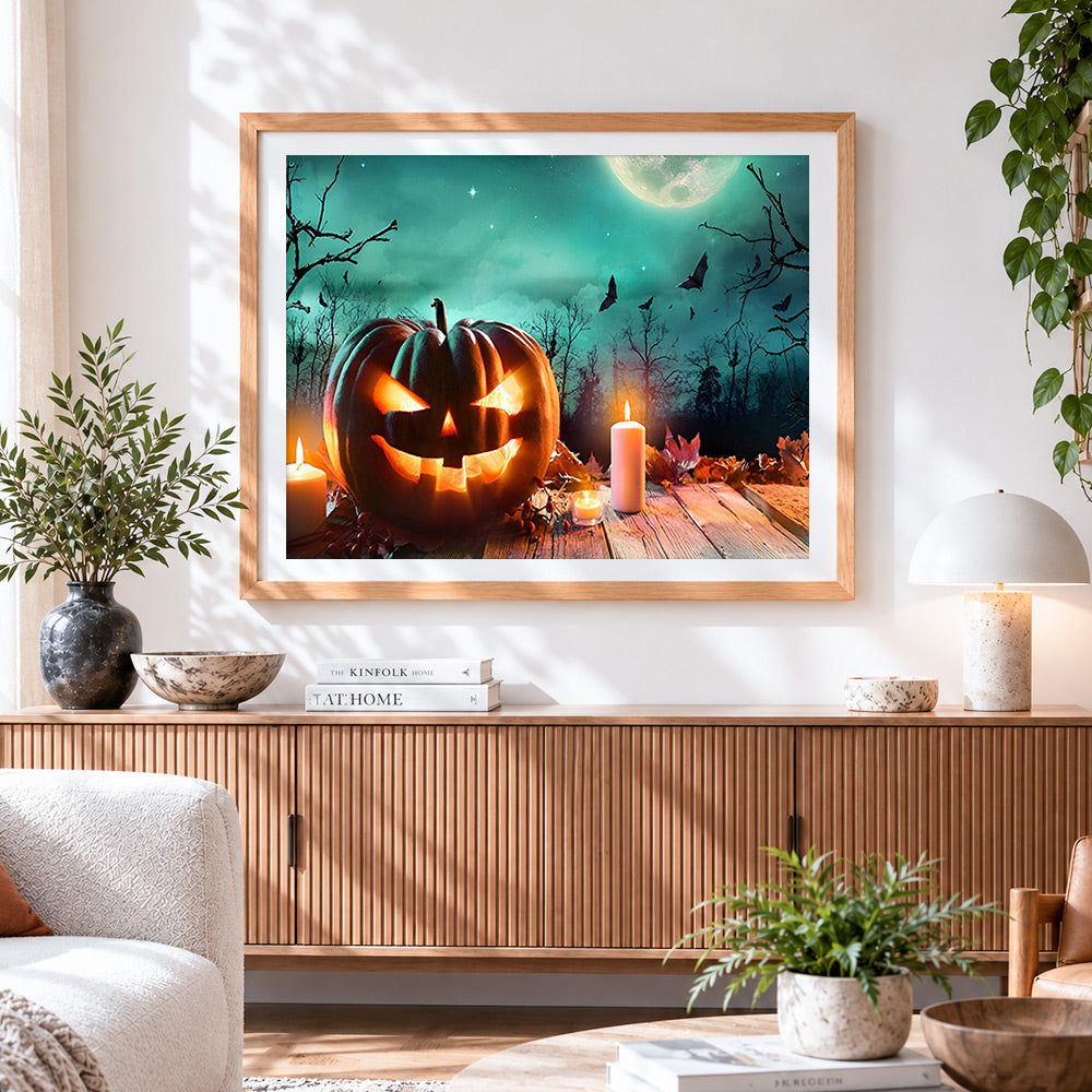 Finished spooky glowing jack o lantern with candles cross stitch artwork displayed