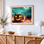 Spooky glowing jack o lantern with candles cross stitch artwork displayed on wall as home decor