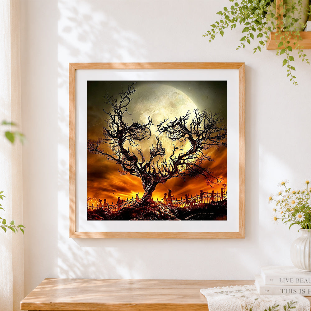 Finished spooky halloween tree and skull moon cross stitch artwork displayed