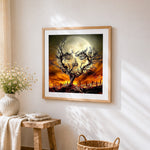 Spooky halloween tree and skull moon cross stitch artwork displayed on wall as home decor