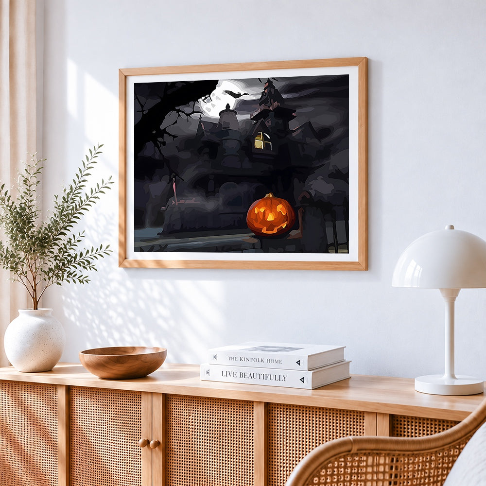 Spooky haunted house and glowing pumpkin cross stitch artwork displayed on wall as home decor