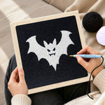 Creating handmade spooky white bat punch needle artwork