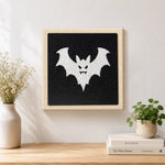 Finished spooky white bat artwork displayed on a wall