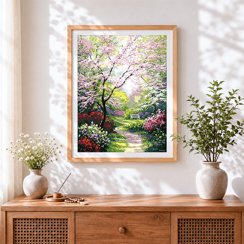 Finished spring blossom garden path cross stitch artwork displayed