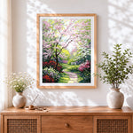 Finished spring blossom garden path cross stitch artwork displayed